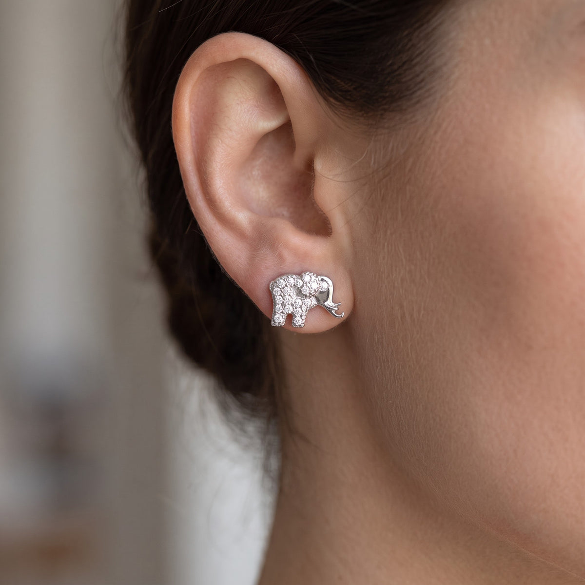 Sterling Silver CZ Lucky Elephant Stud Earrings worn, lifestyle photo