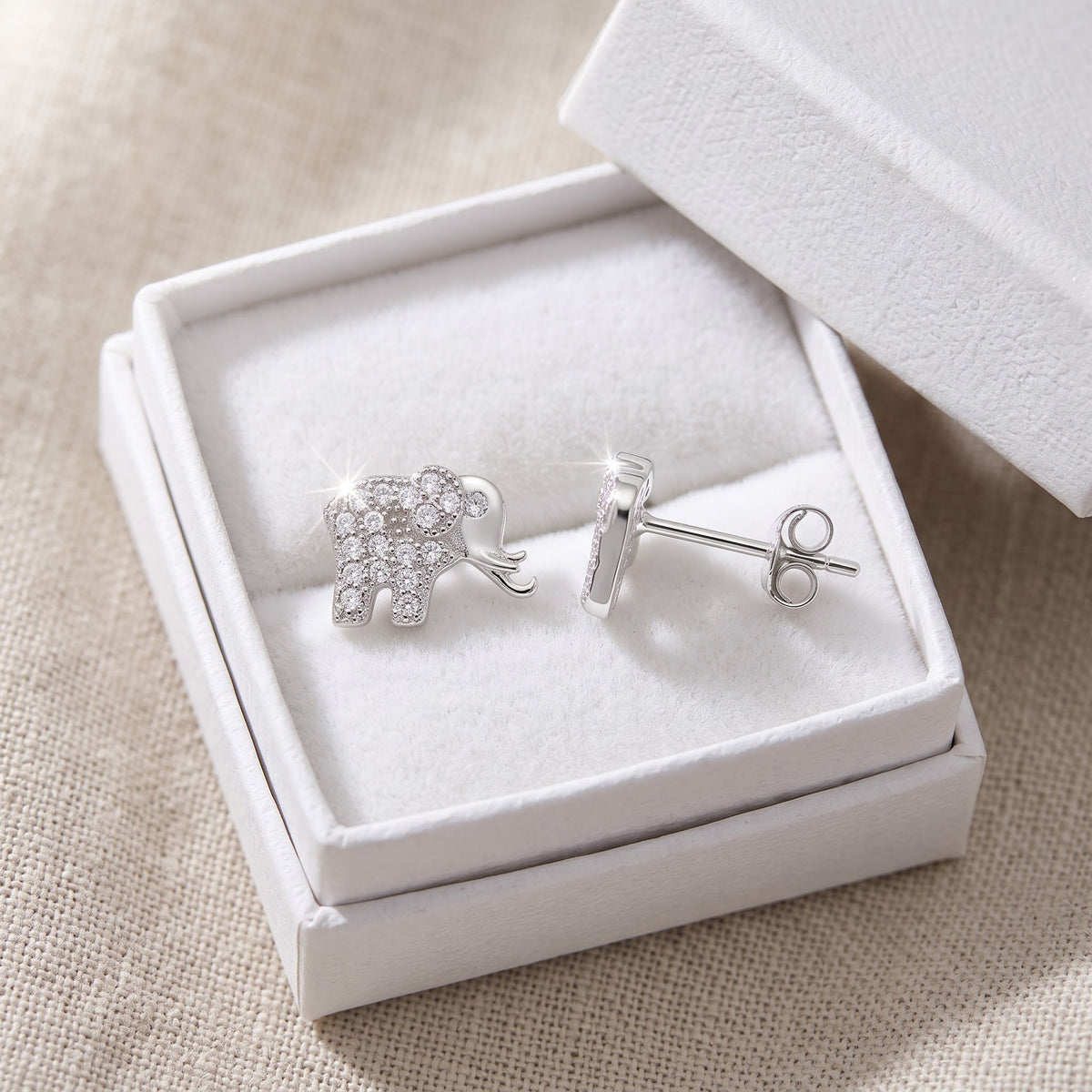 Sterling Silver CZ Lucky Elephant Stud Earrings in a white gift box, ready to give