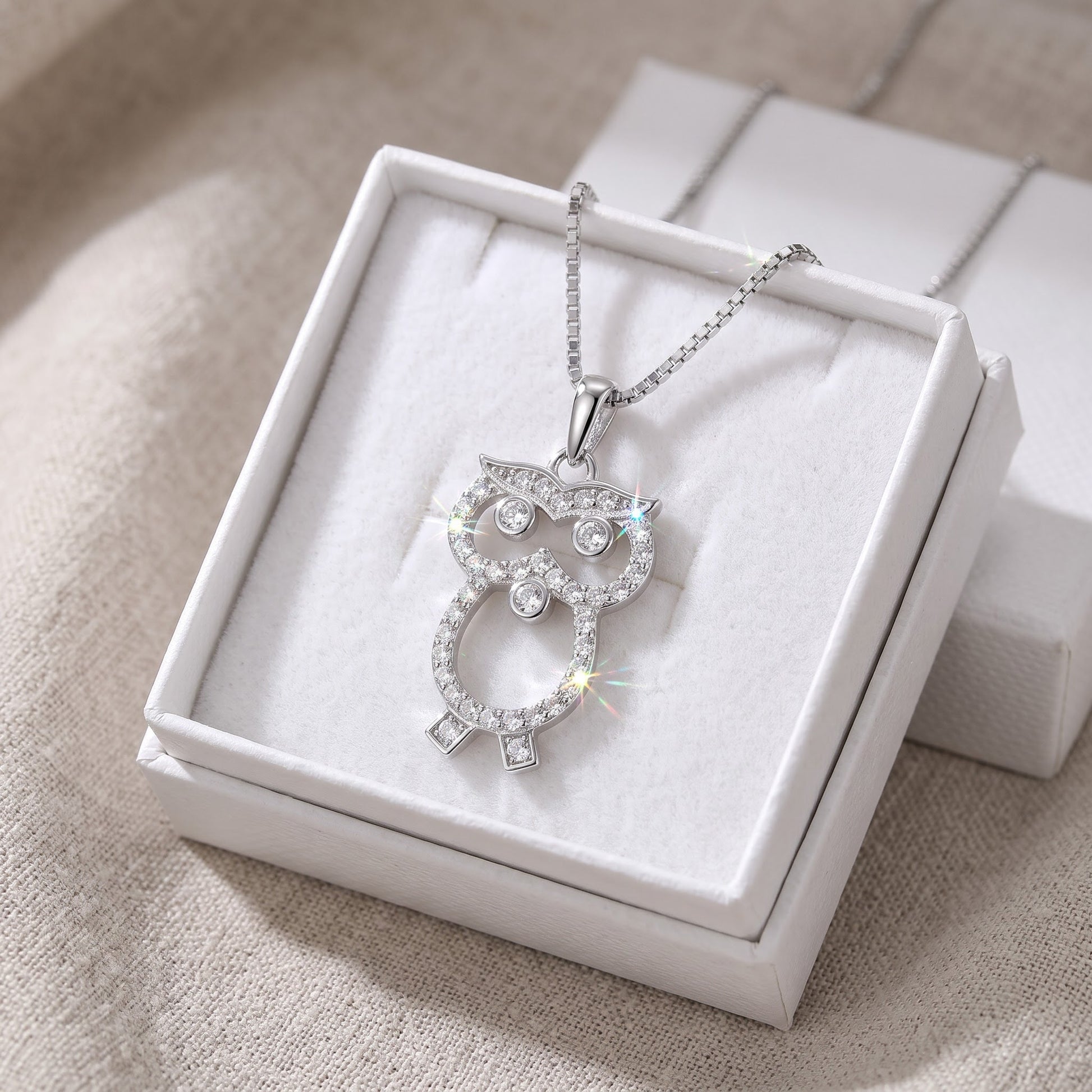 Sterling Silver CZ Owl Necklace in a white gift box, ready to give