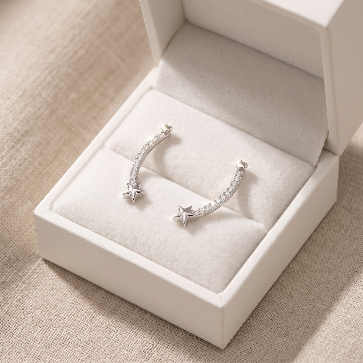 Sterling Silver CZ Shooting Star Ear Crawler Stud Earrings in a white gift box, ready to give