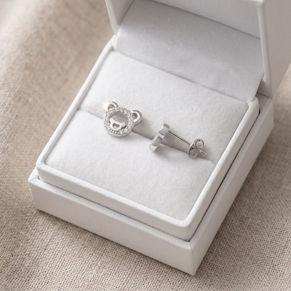 Sterling Silver CZ Teddy Bear Stud Earrings in a white gift box, ready to give