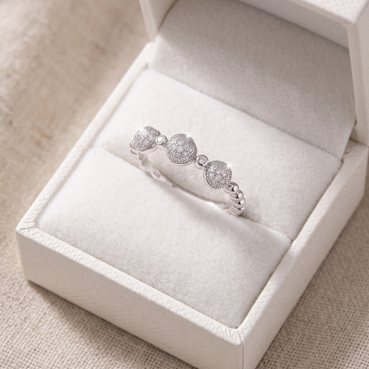 Sterling Silver CZ Thin Domed Stackable Ring in a white gift box, ready to give