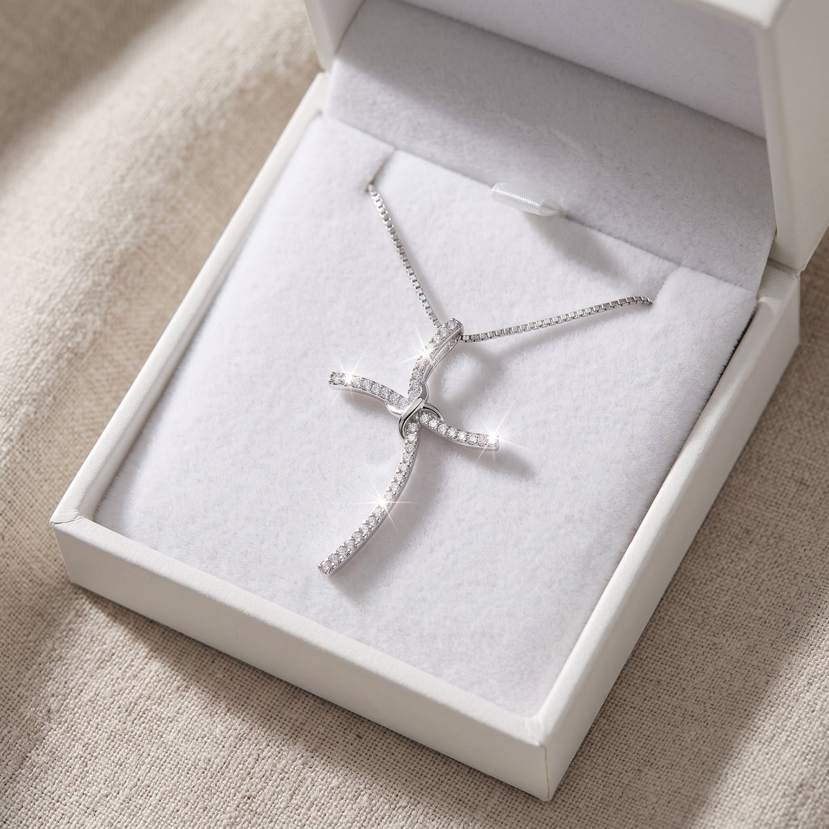 Sterling Silver CZ Thin Wavy Cross Necklace, 18" in a white gift box, ready to give