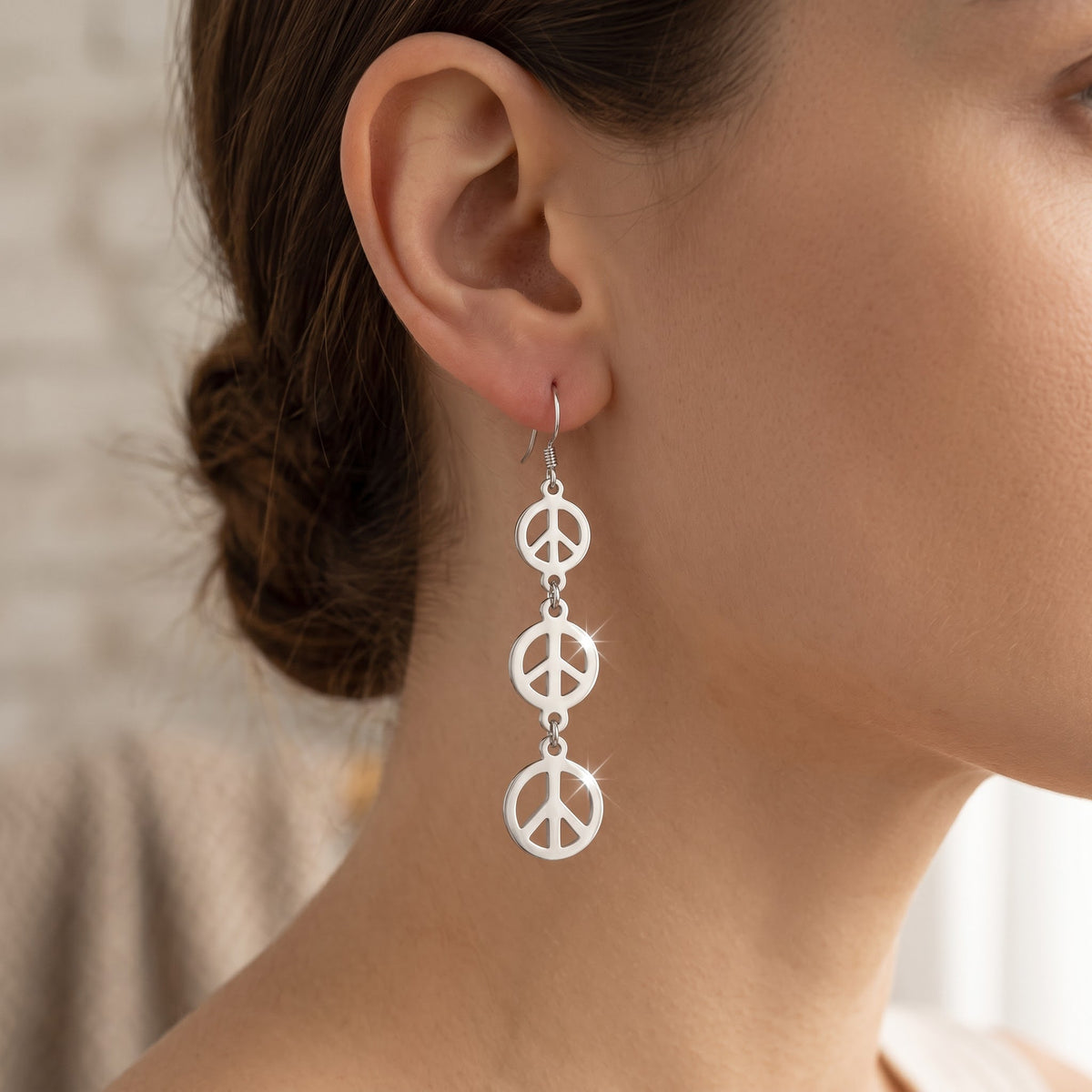 Sterling Silver Dangling Peace Sign Earrings worn, lifestyle photo