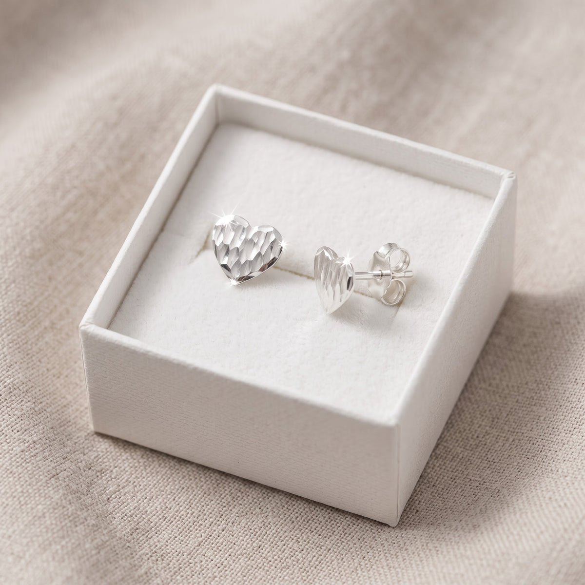 Sterling Silver Diamond Cut Heart Stud Earrings, 7mm in a white gift box, ready to give