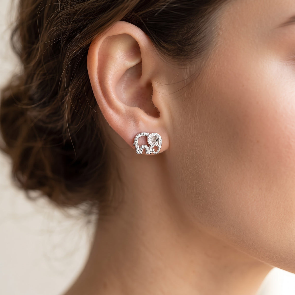 Sterling Silver Elephant Stud Earrings worn, lifestyle photo