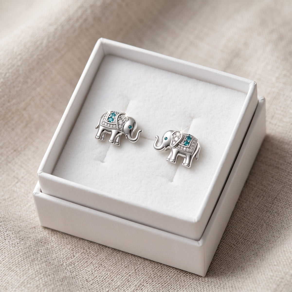 Sterling Silver Elephant Stud Earrings in a white gift box, ready to give