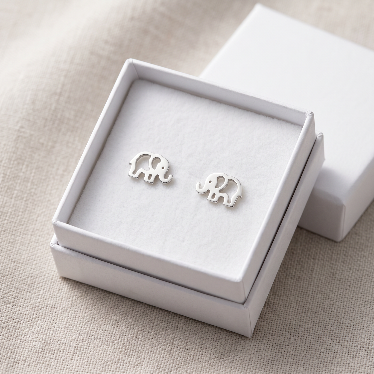 Sterling Silver Elephant Stud Earrings in a white gift box, ready to give