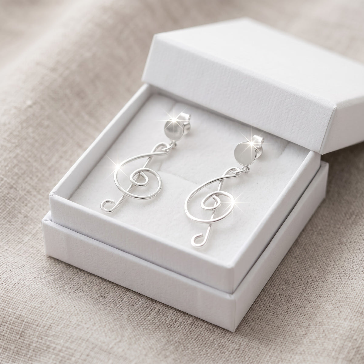 Sterling Silver G Clef Music Note Dangle Earrings in a white gift box, ready to give