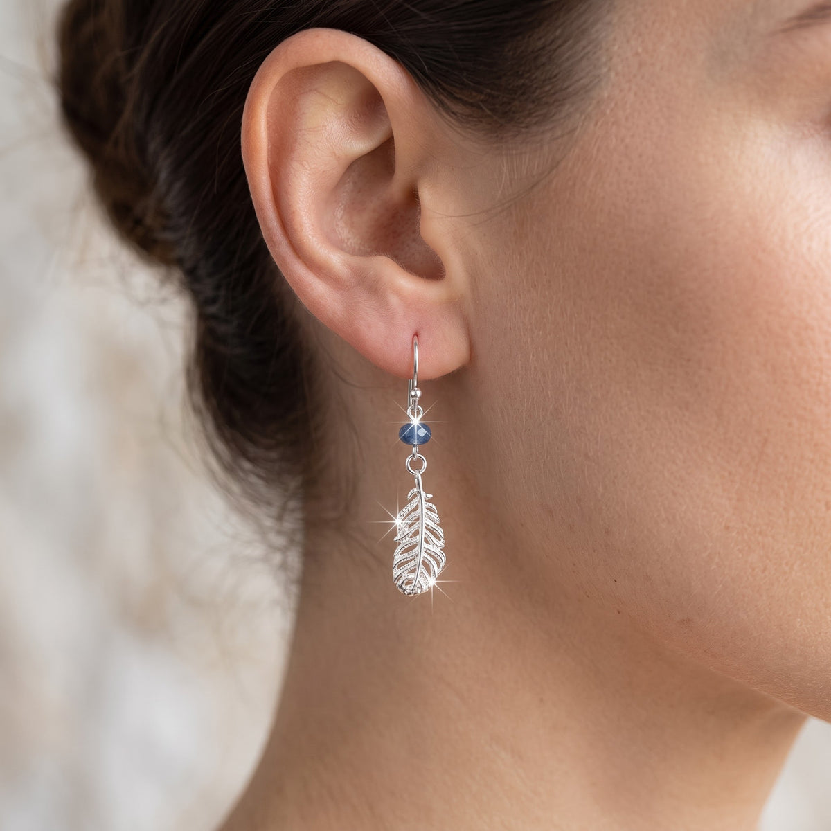 Sterling Silver Girls Blue Bead Native American Inspired Feather Drop Earrings worn, lifestyle photo