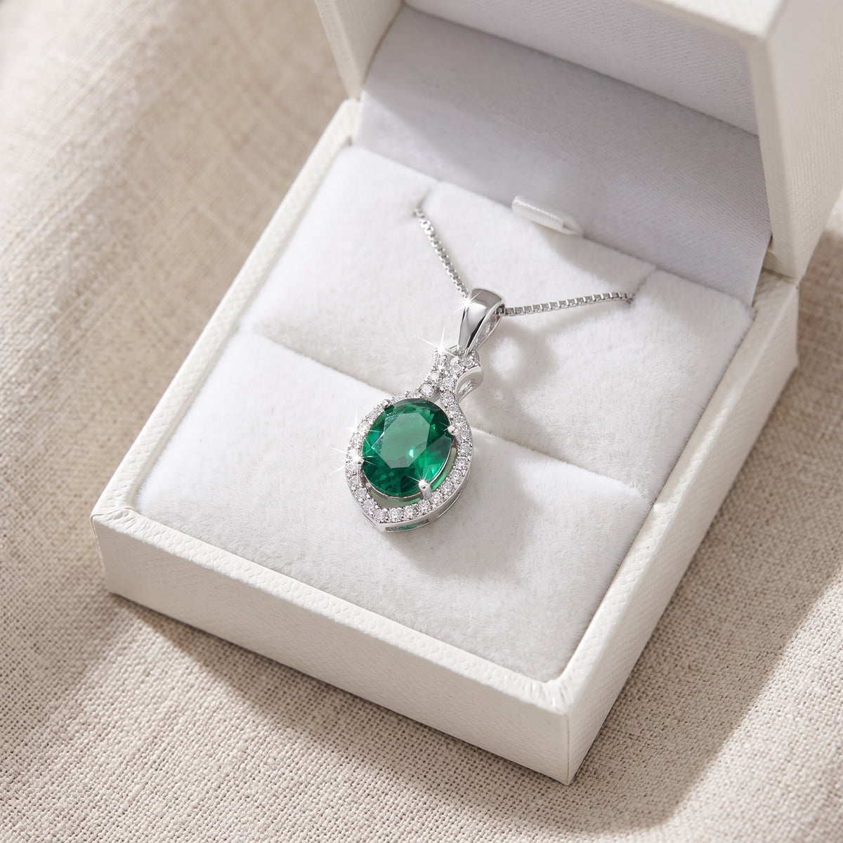 Sterling Silver Green CZ Oval Drop Necklace in a white gift box, ready to give