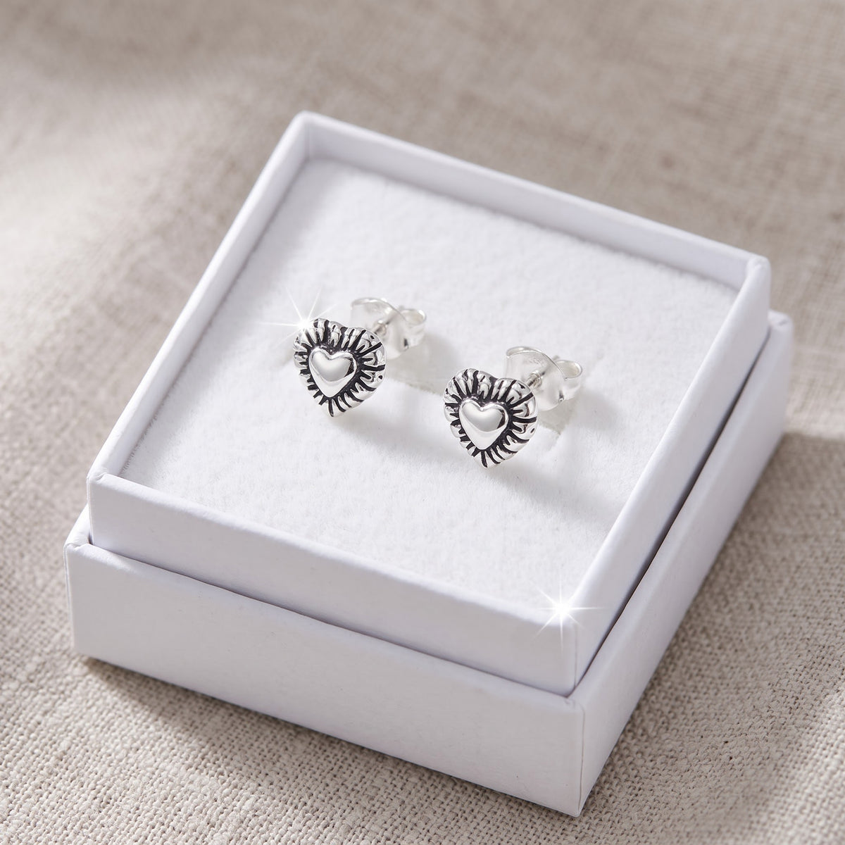Sterling Silver Heart Stud Earrings - 7mm in a white gift box, ready to give