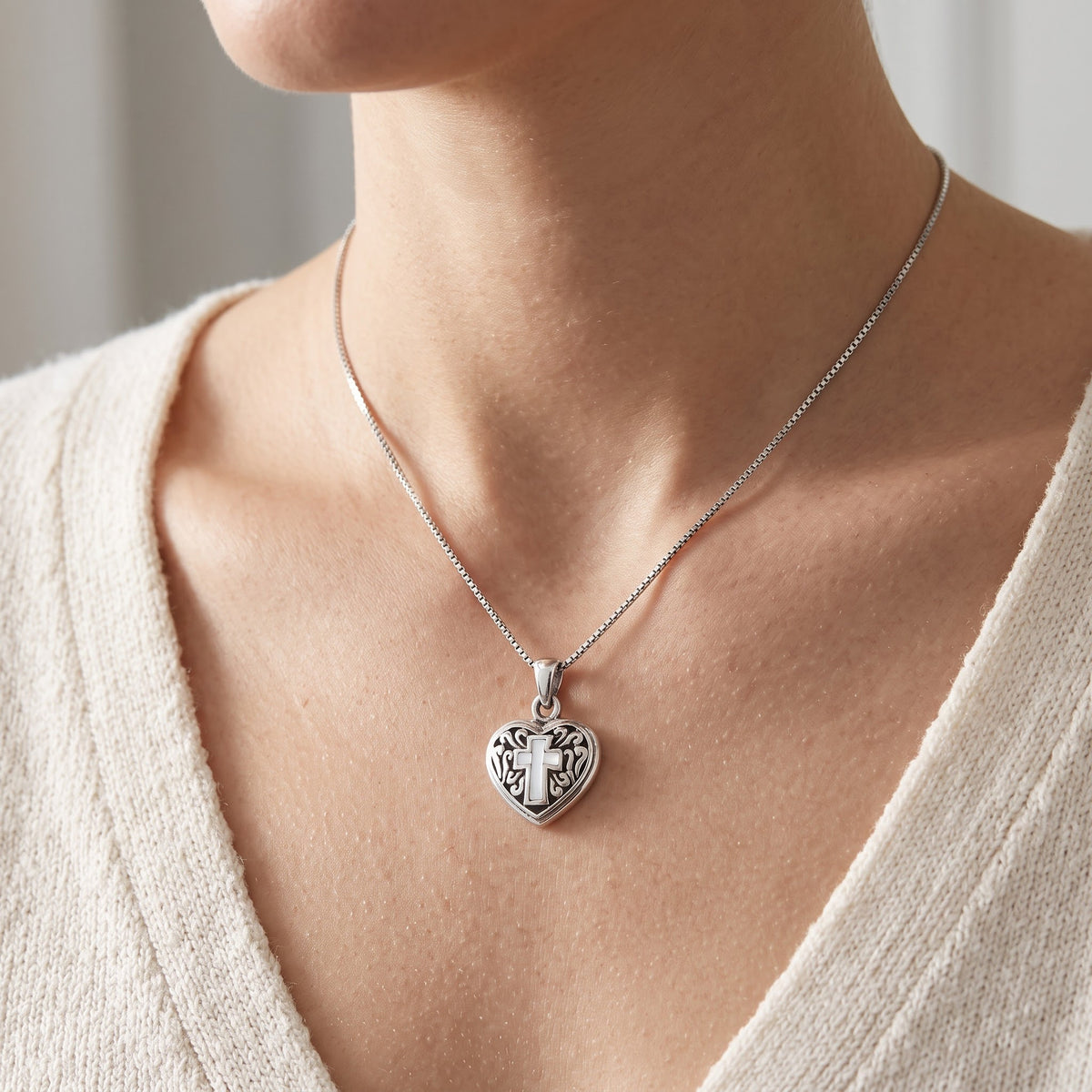 Sterling Silver Mother Of Pearl Cross Heart Necklace worn, lifestyle photo