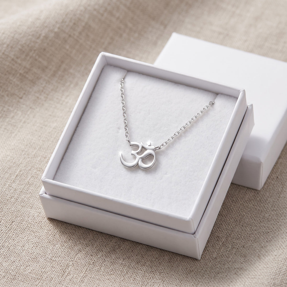 Sterling Silver Om Necklace in a white gift box, ready to give