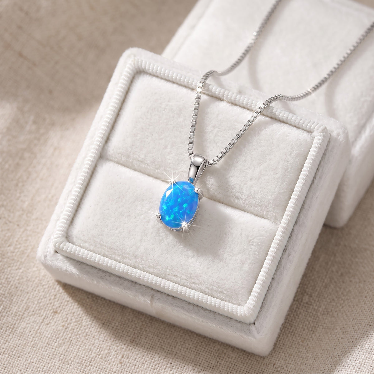Sterling Silver Oval Created Blue Opal Necklace, 18" in a white gift box, ready to give