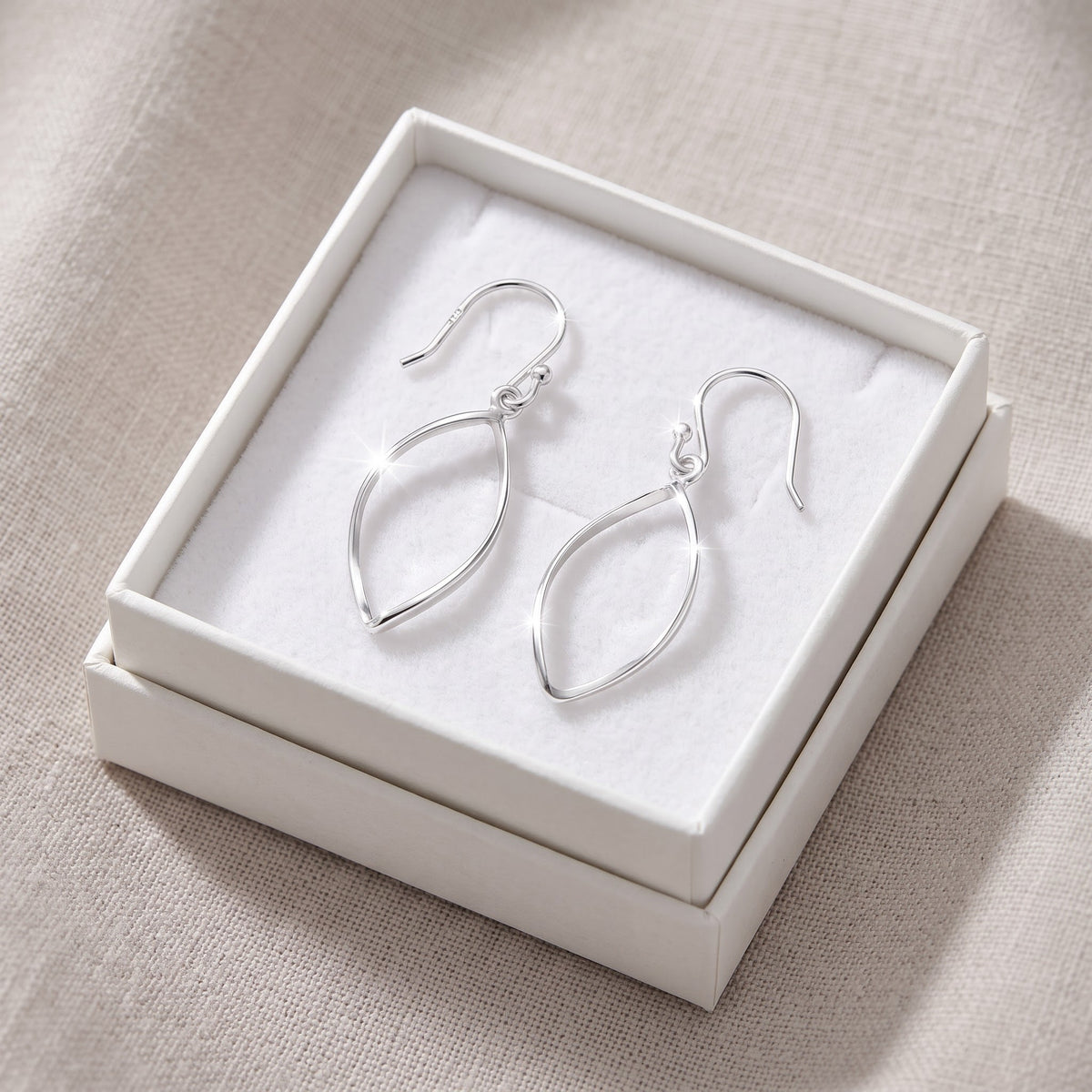 Sterling Silver Oval Drop Earrings in a white gift box, ready to give