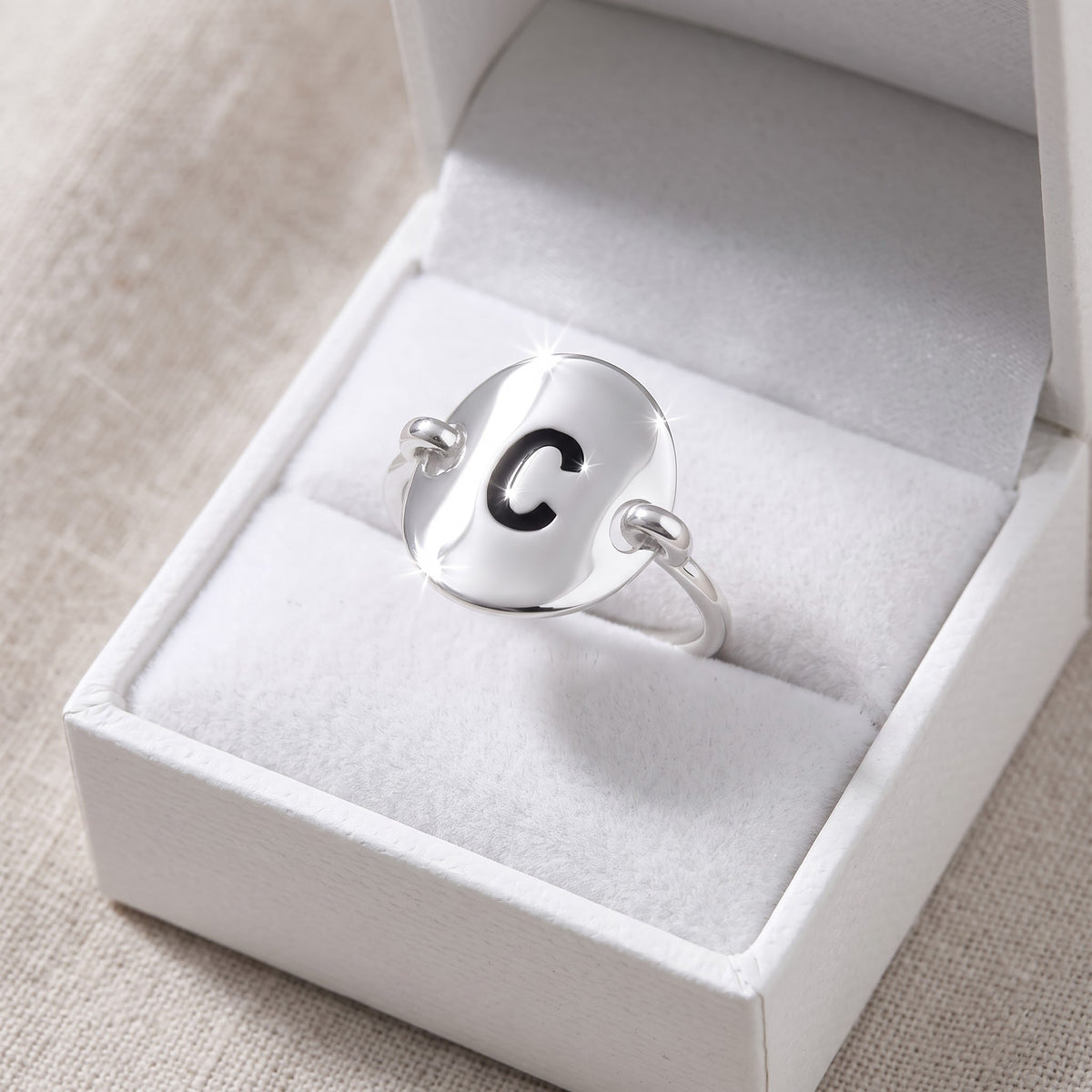 Sterling Silver Oval Initial C Ring in a white gift box, ready to give