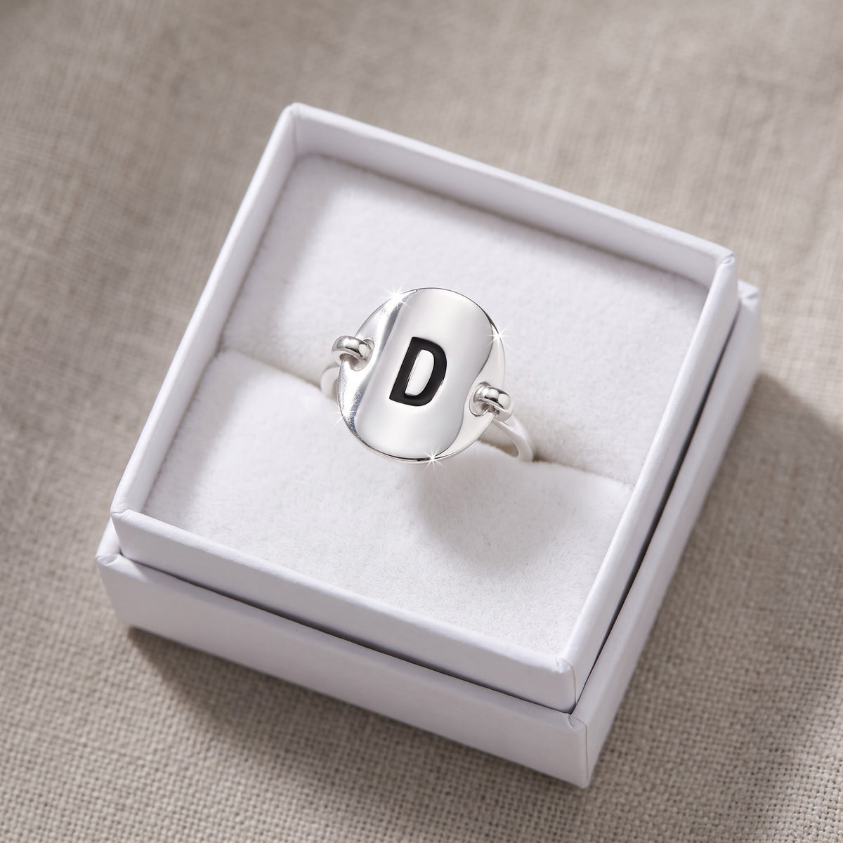 Sterling Silver Oval Initial D Ring in a white gift box, ready to give