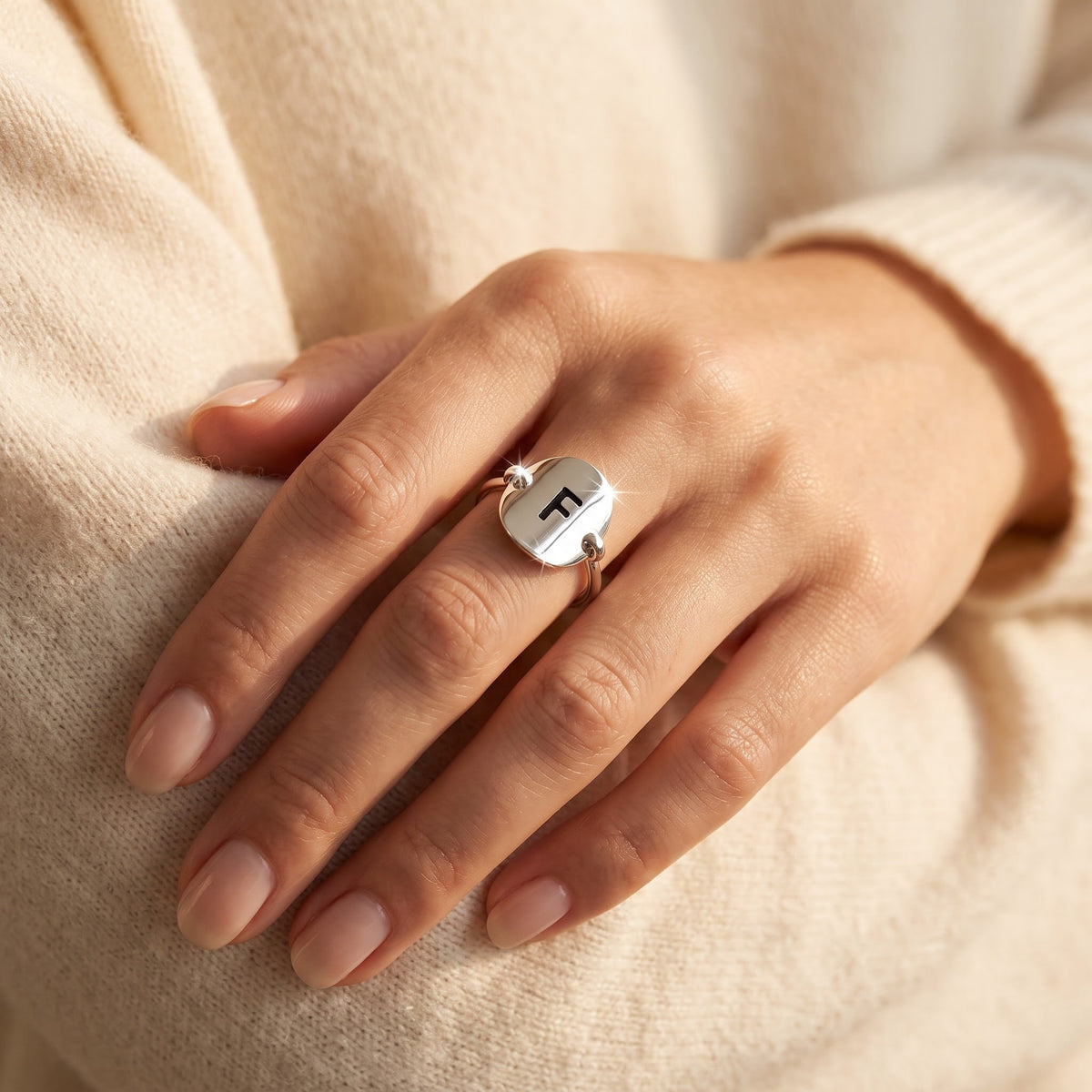 Sterling Silver Oval Initial F Ring worn, lifestyle photo