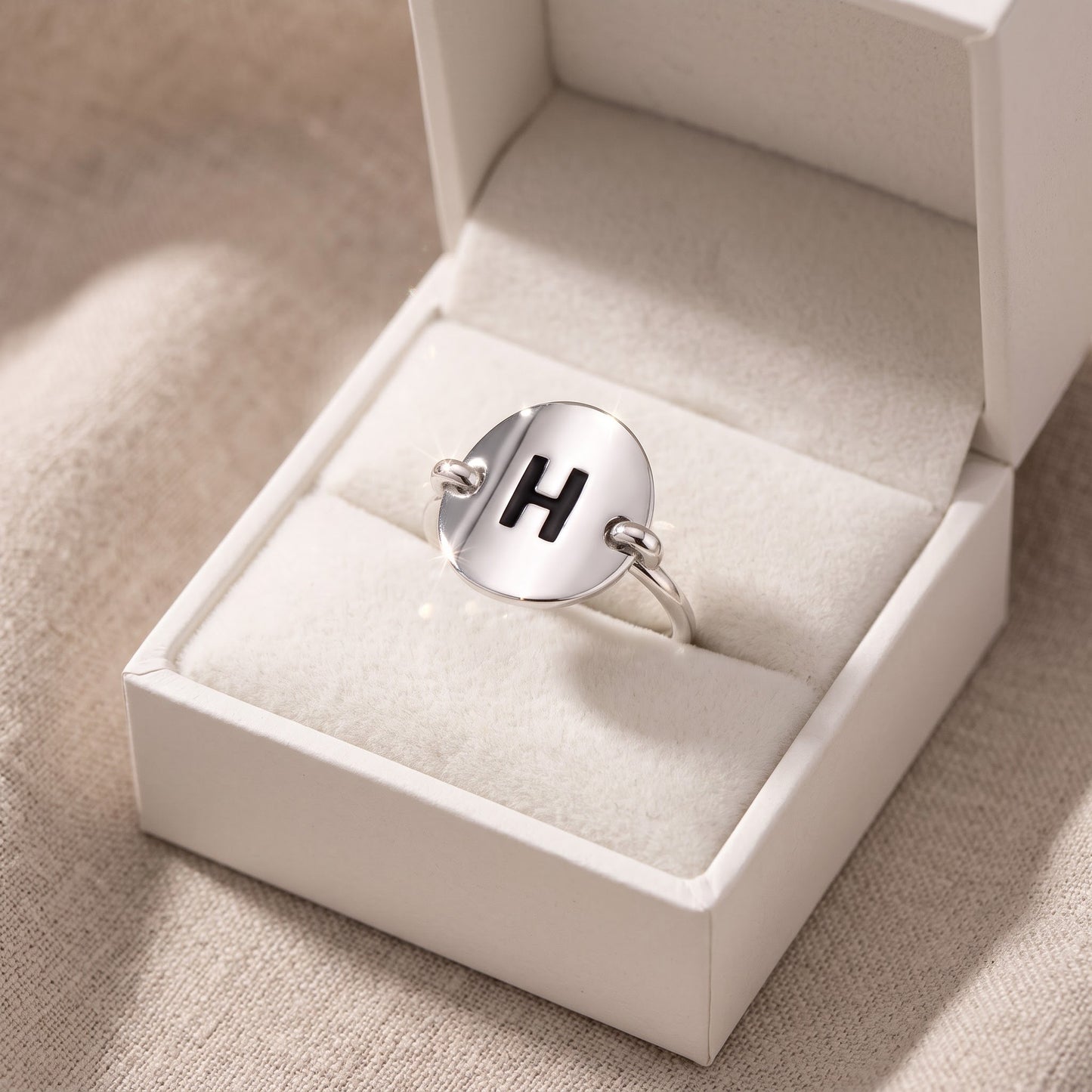 Sterling Silver Oval Initial H Ring in a white gift box, ready to give