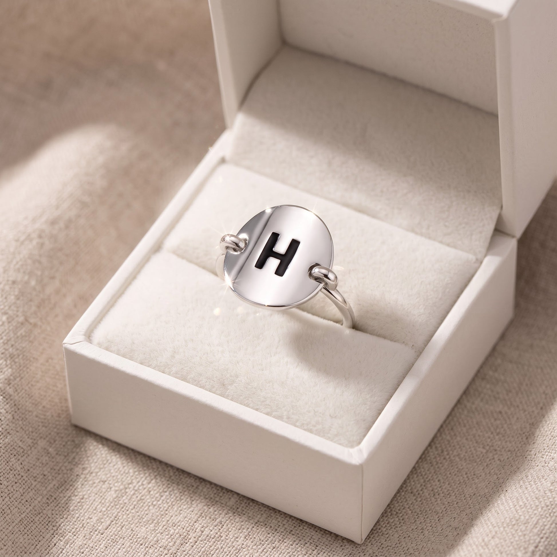 Sterling Silver Oval Initial H Ring in a white gift box, ready to give