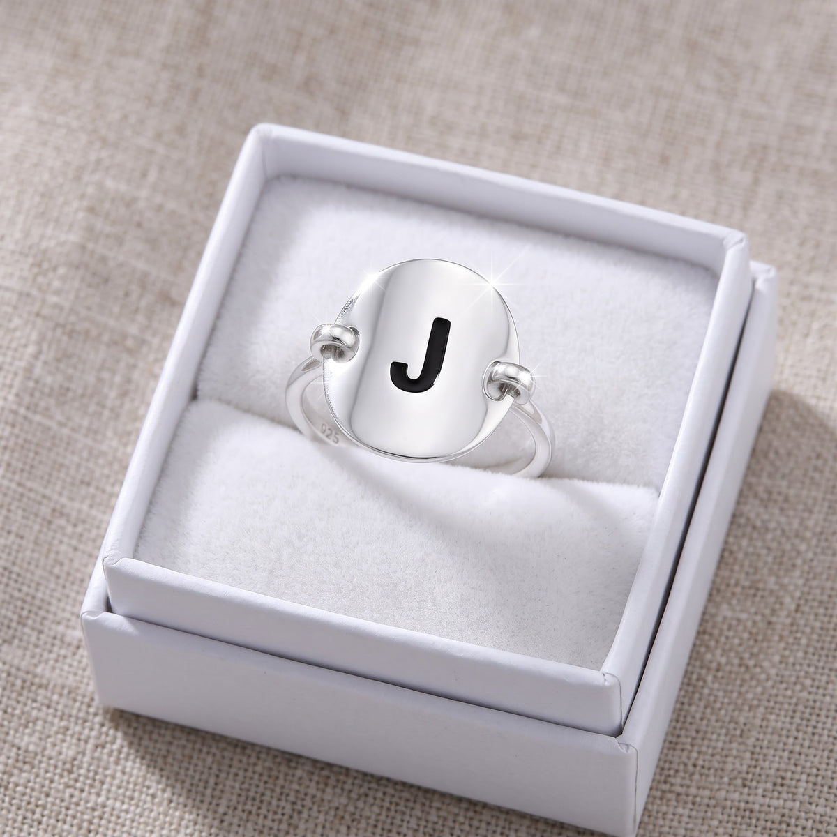 Sterling Silver Oval Initial J Ring in a white gift box, ready to give