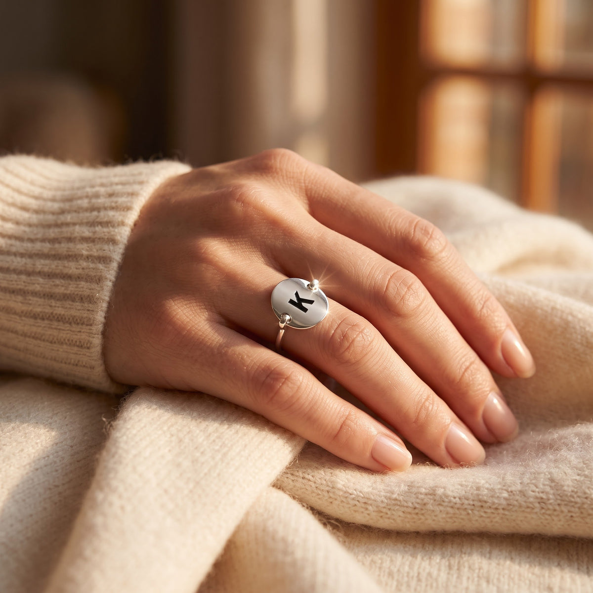 Sterling Silver Oval Initial K Ring worn, lifestyle photo
