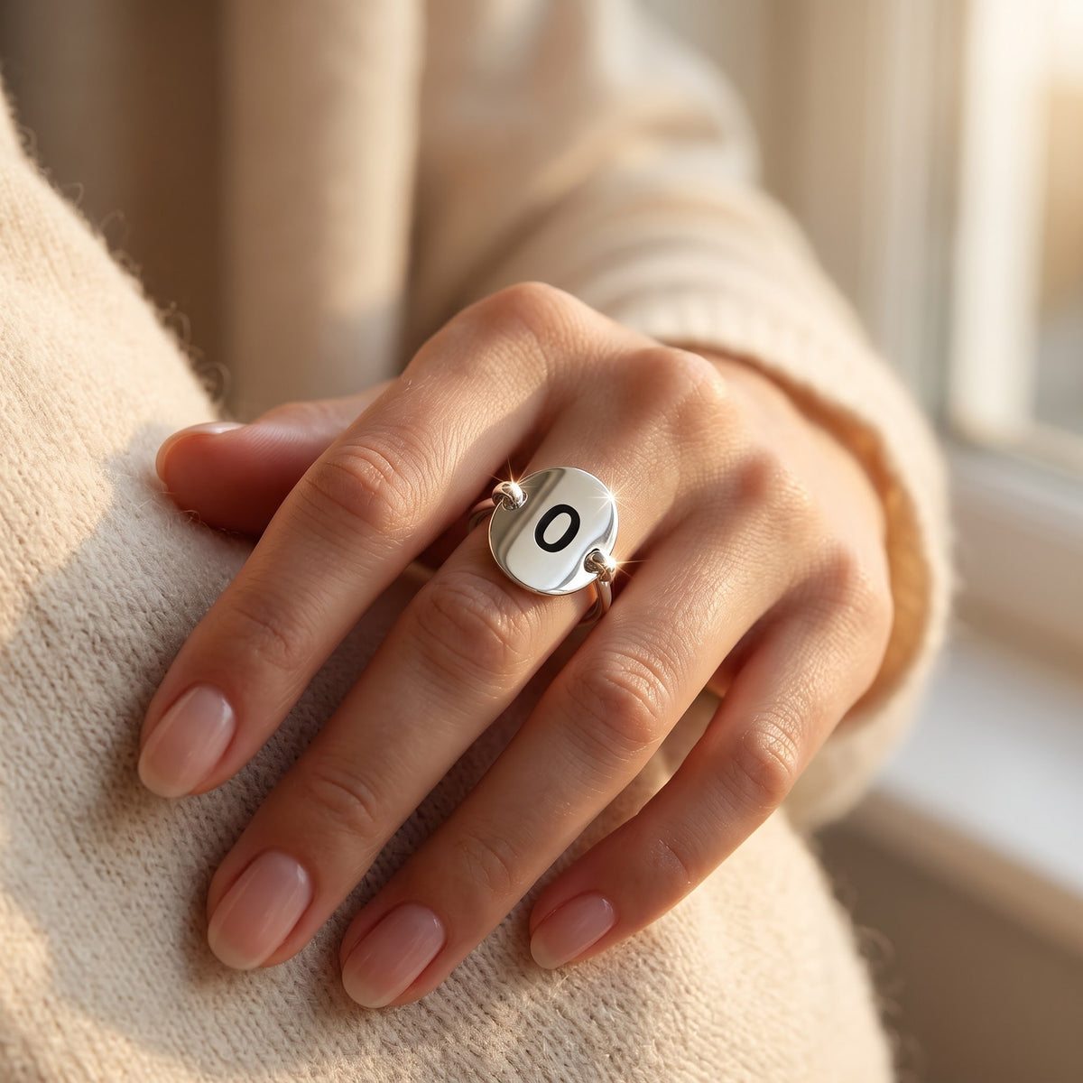 Sterling Silver Oval Initial O Ring worn, lifestyle photo
