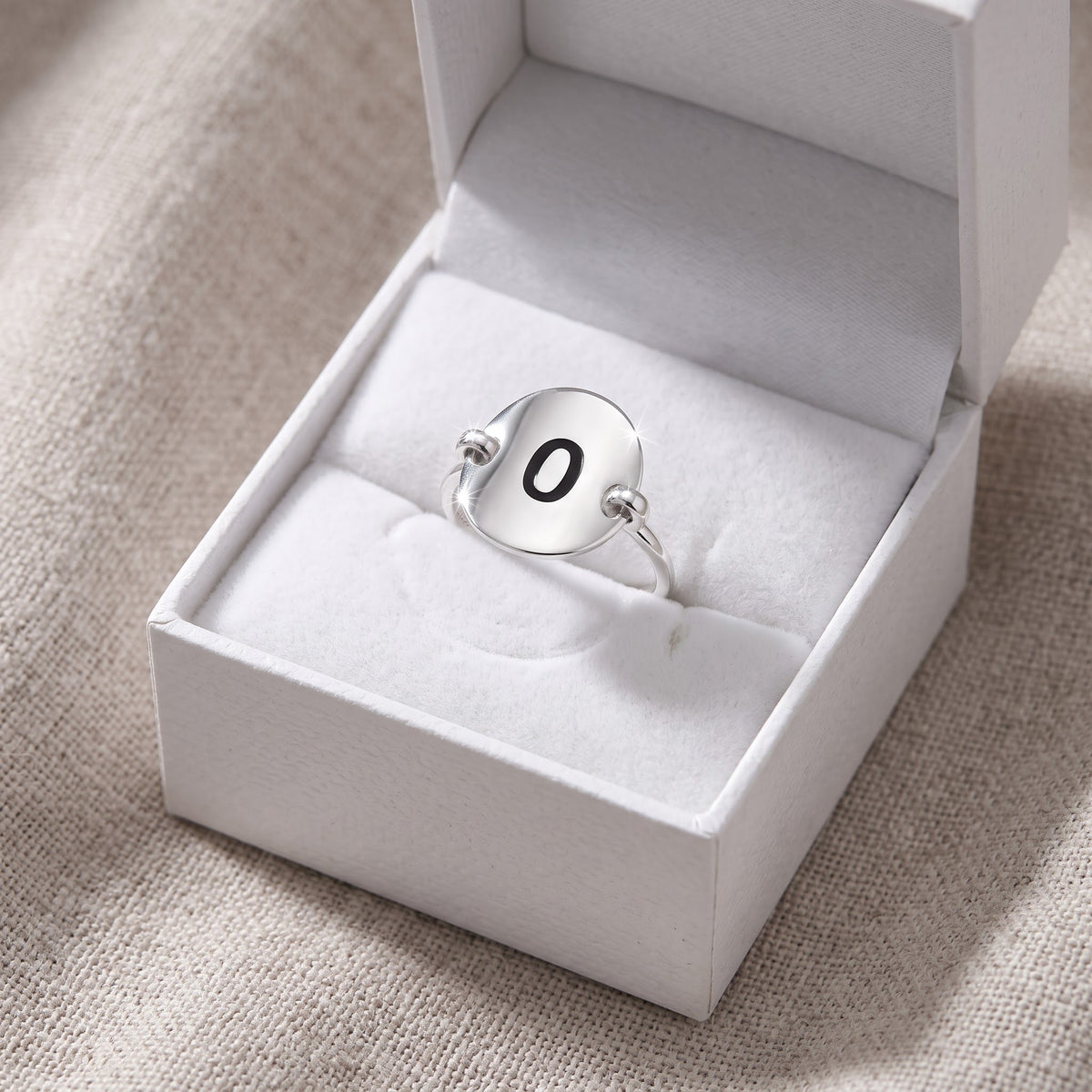 Sterling Silver Oval Initial O Ring in a white gift box, ready to give
