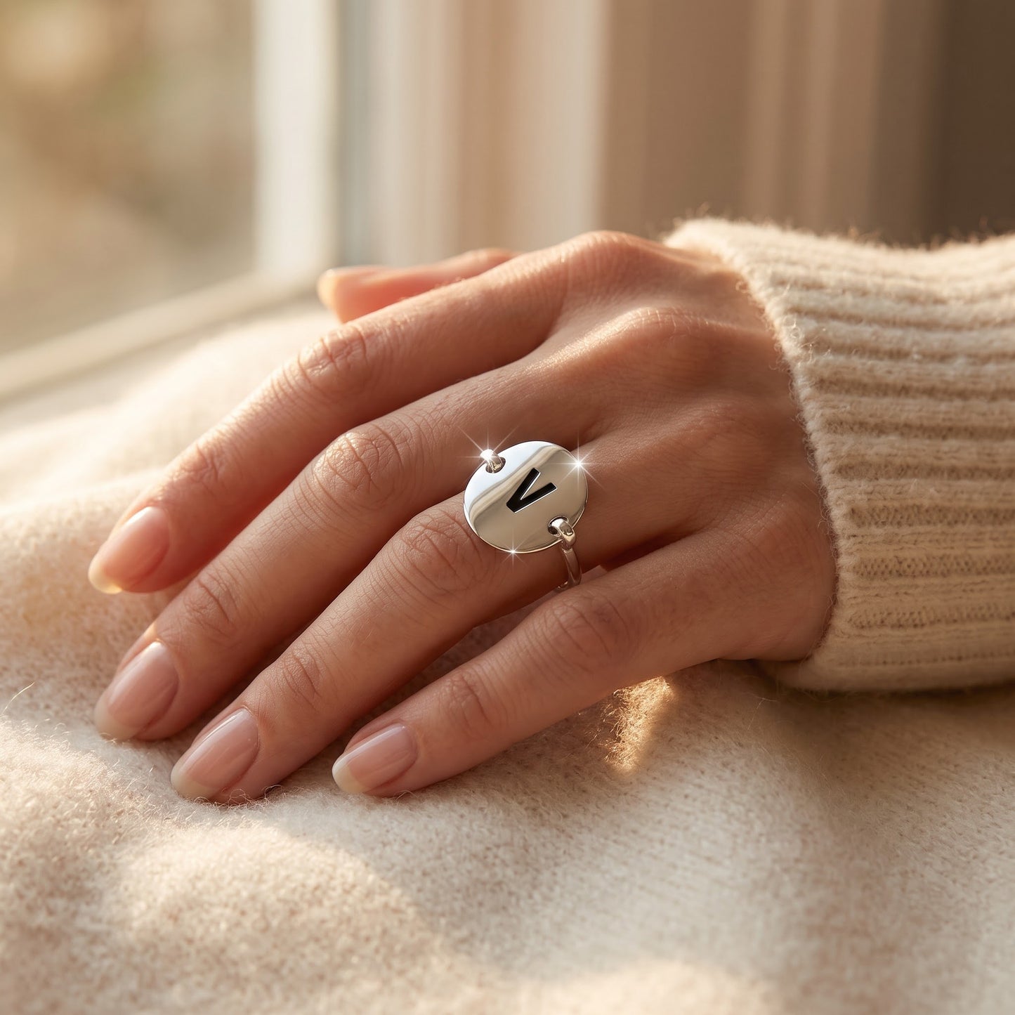 Sterling Silver Oval Initial V Ring worn, lifestyle photo