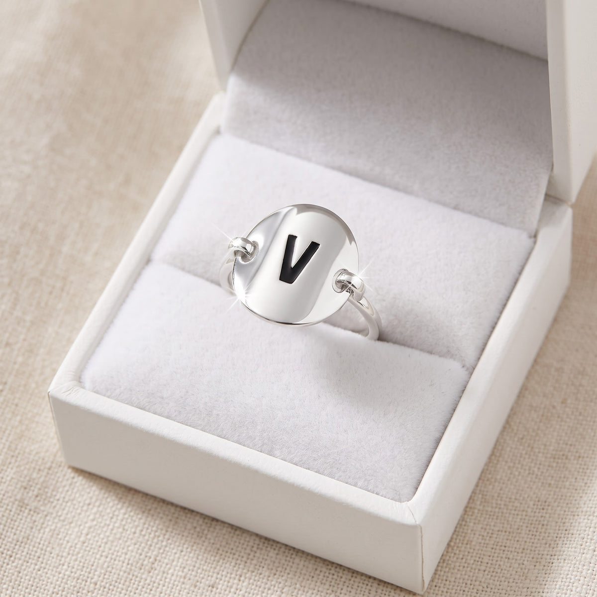Sterling Silver Oval Initial V Ring in a white gift box, ready to give