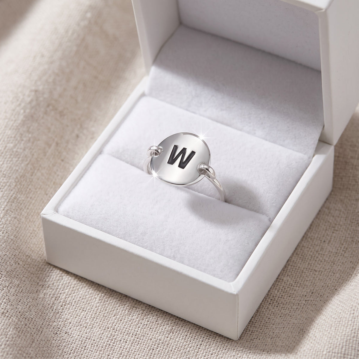 Sterling Silver Oval Initial W Ring in a white gift box, ready to give