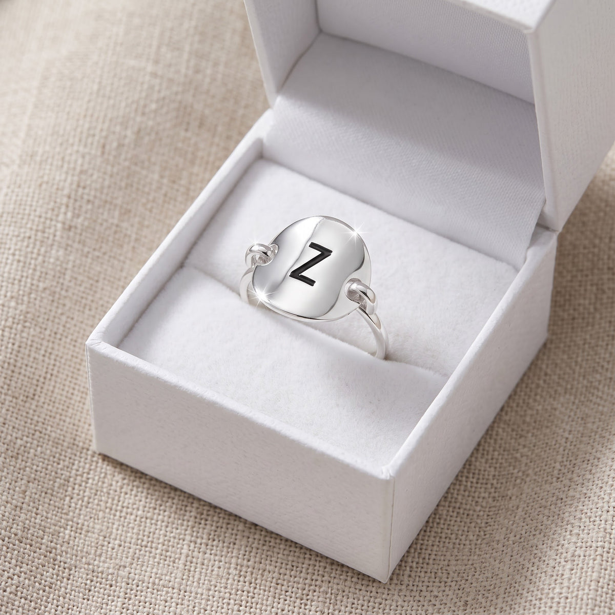 Sterling Silver Oval Initial Z Ring in a white gift box, ready to give