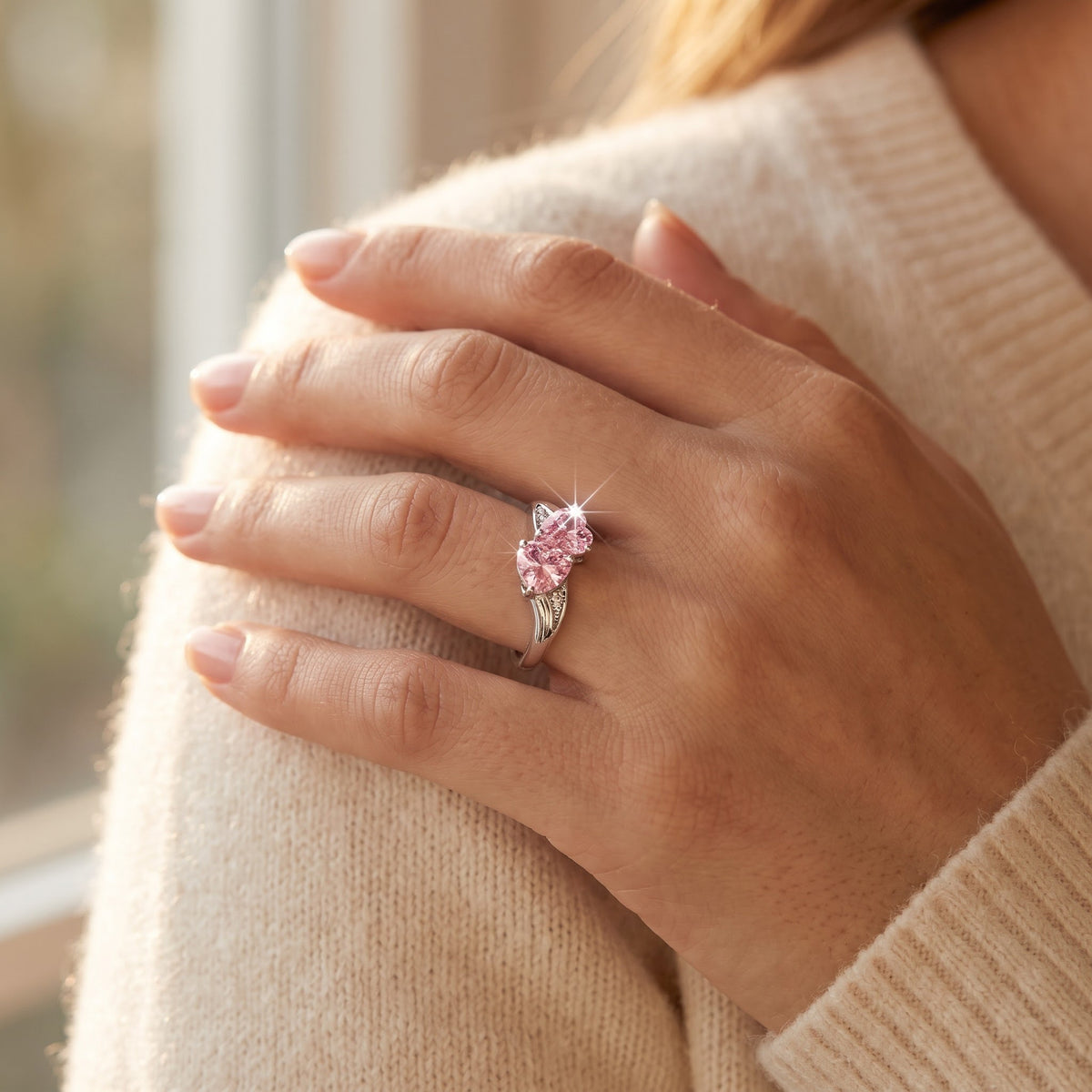 Sterling Silver Pink CZ Double Heart Ring worn, lifestyle photo