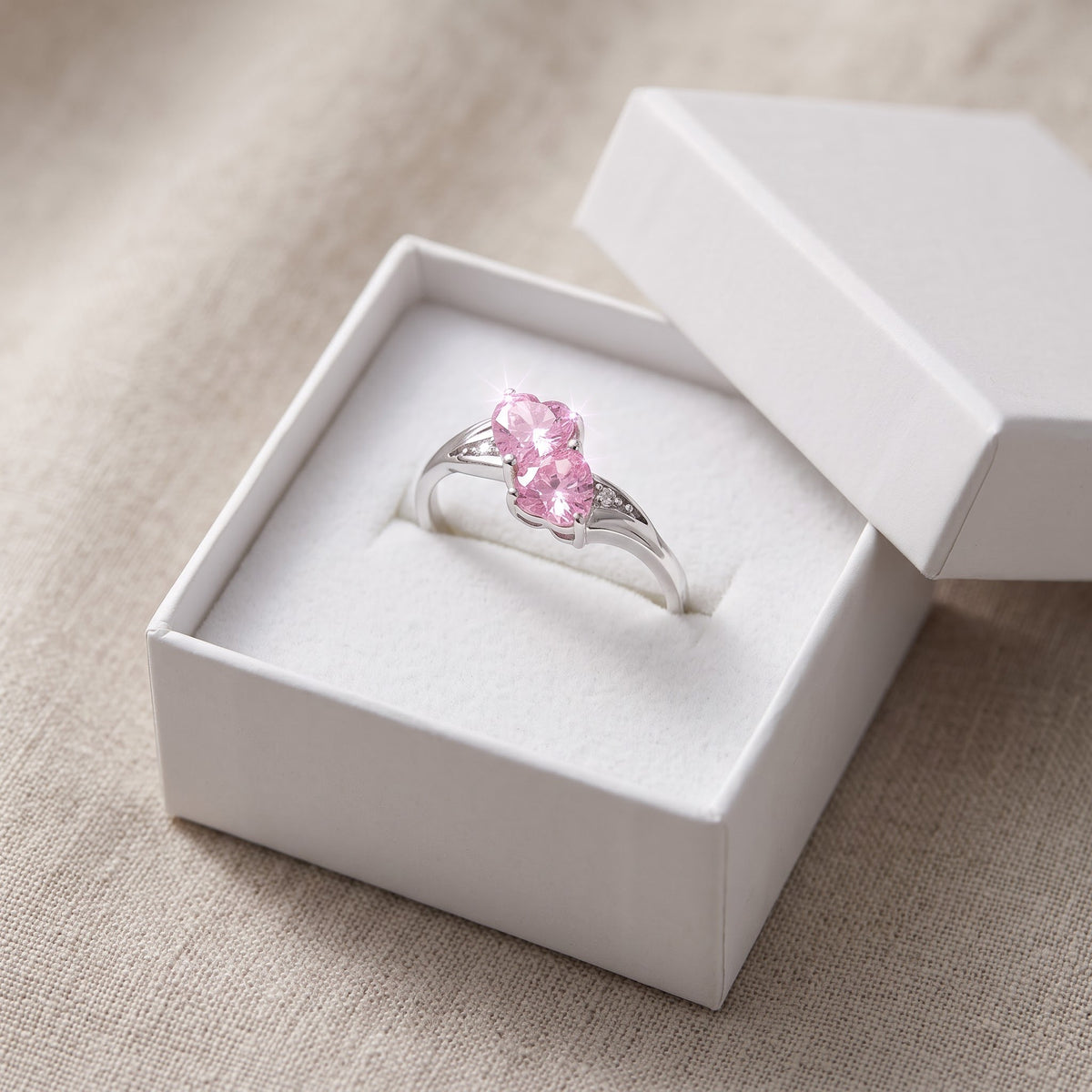 Sterling Silver Pink CZ Double Heart Ring in a white gift box, ready to give