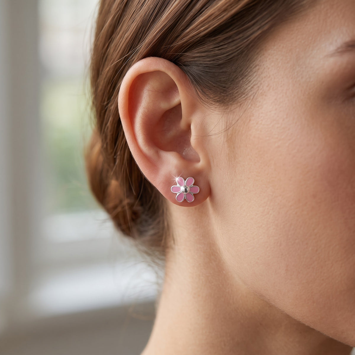 Sterling Silver Dainty Women's Pink Daisy Flower Stud Earrings worn, lifestyle photo