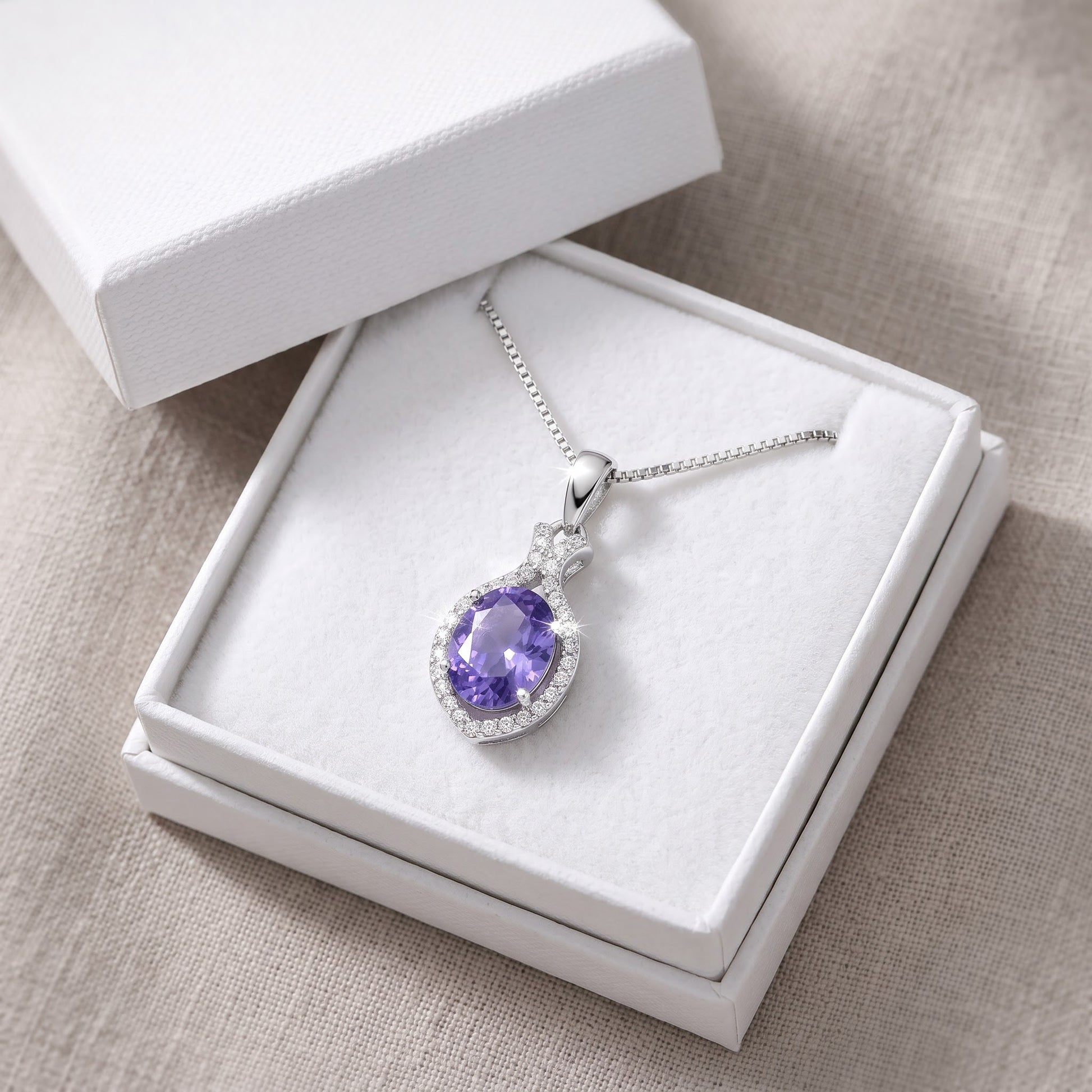 Sterling Silver Purple CZ Oval Drop Necklace in a white gift box, ready to give