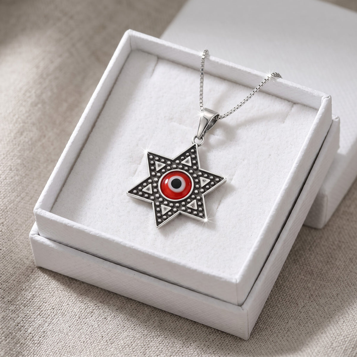 Sterling Silver Red Evil Eye Jewish Star Necklace in a white gift box, ready to give