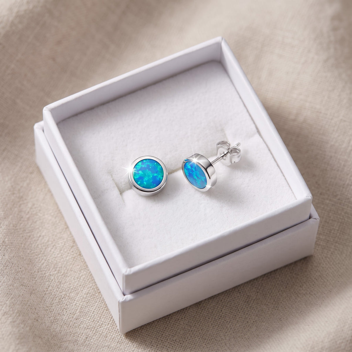 Sterling Silver Girls Round Created Blue Opal Stud Earrings, 7mm in a white gift box, ready to give