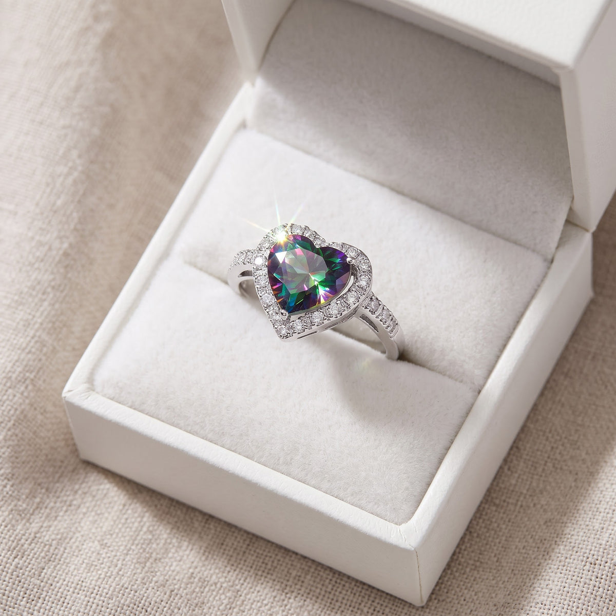 Sterling Silver Simulated Mystic Rainbow Topaz Heart Halo Ring in a white gift box, ready to give