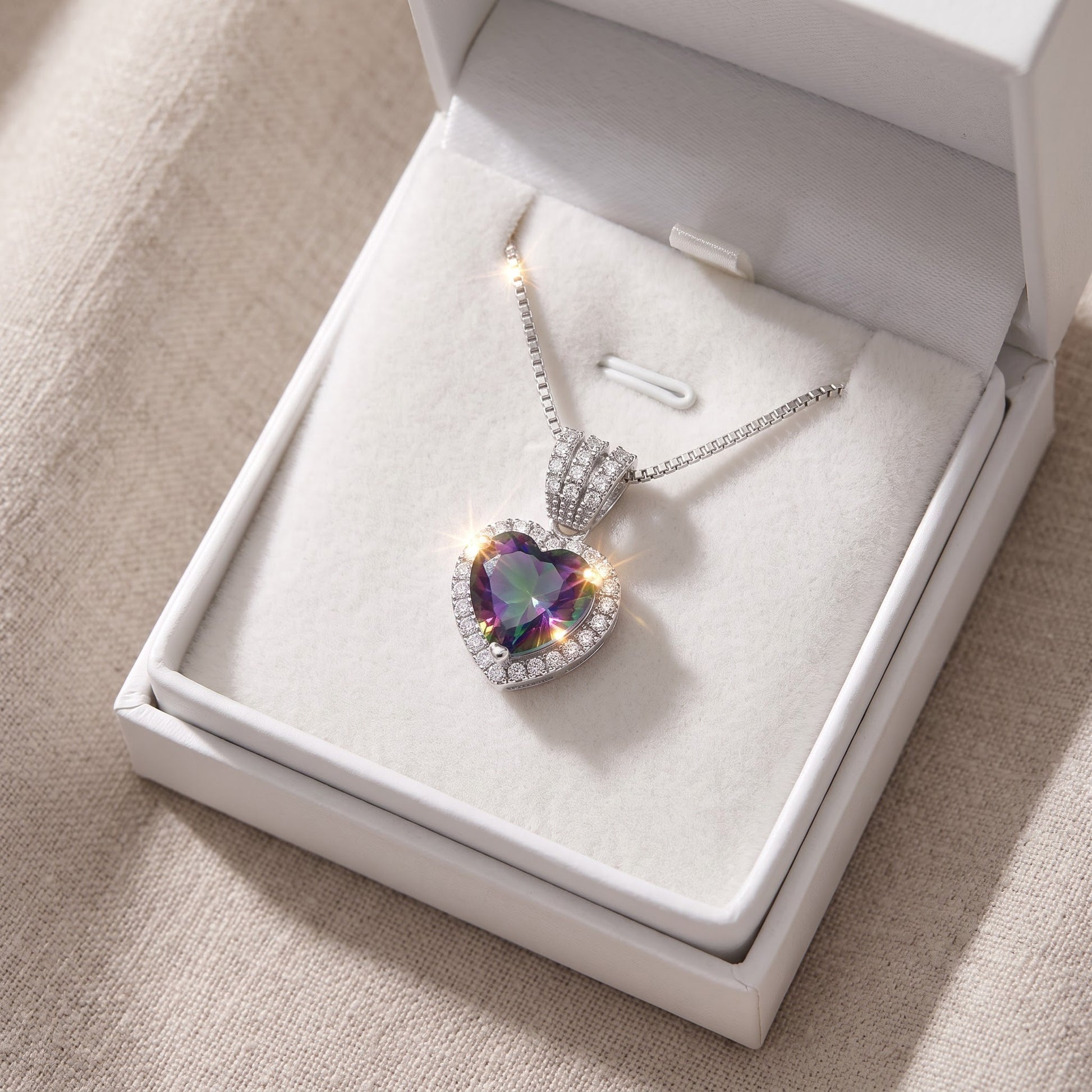 Sterling Silver Simulated Rainbow Topaz Halo Heart Necklace in a white gift box, ready to give