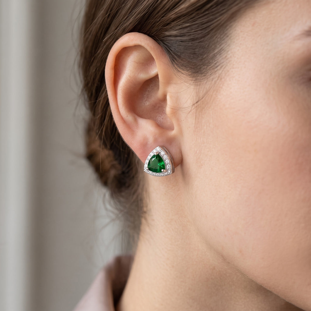 Sterling Silver Simulated Trillion Green Emerald Halo Stud Earrings, 9mm worn, lifestyle photo