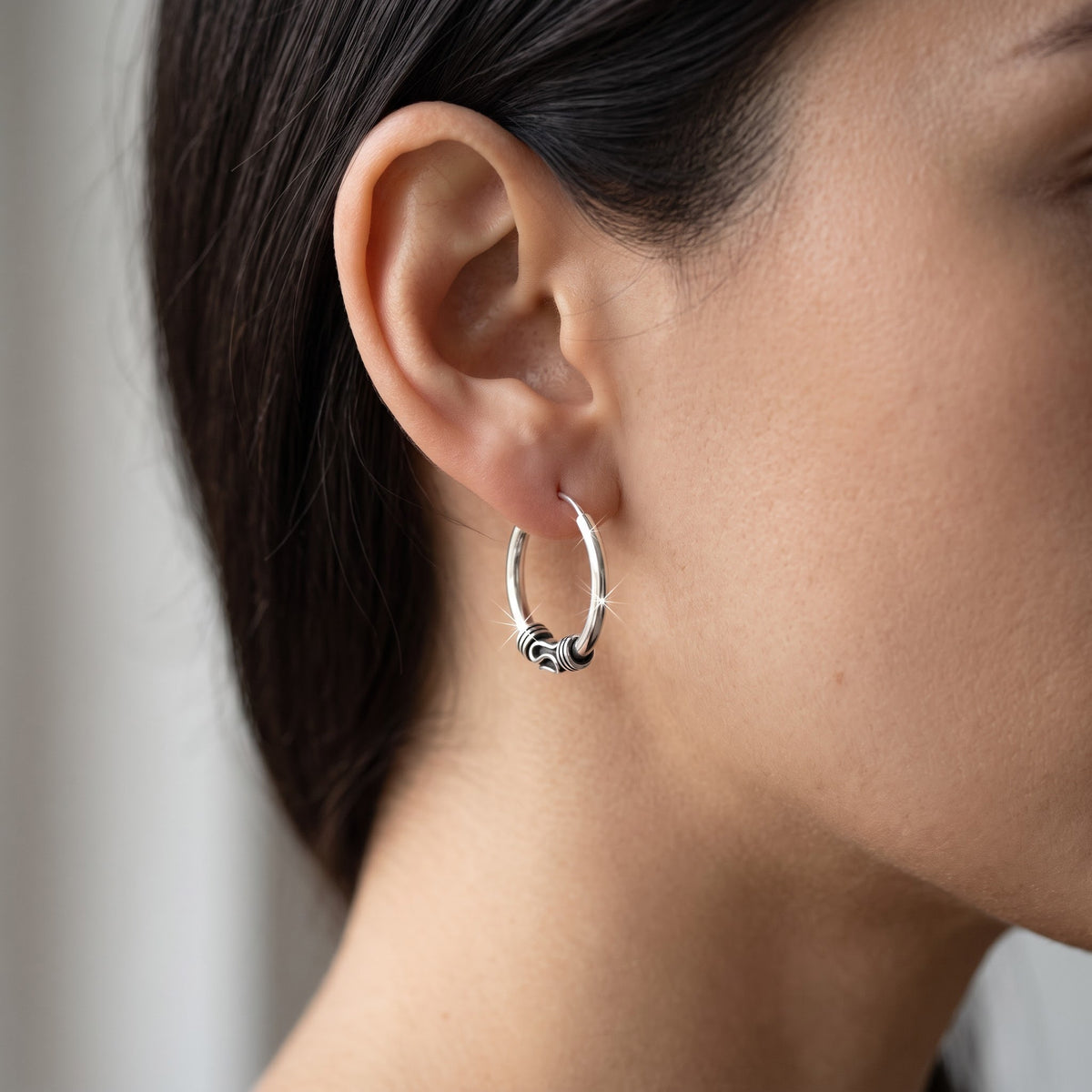 Sterling Silver Ladies Dainty Bali Hoop Earrings worn, lifestyle photo