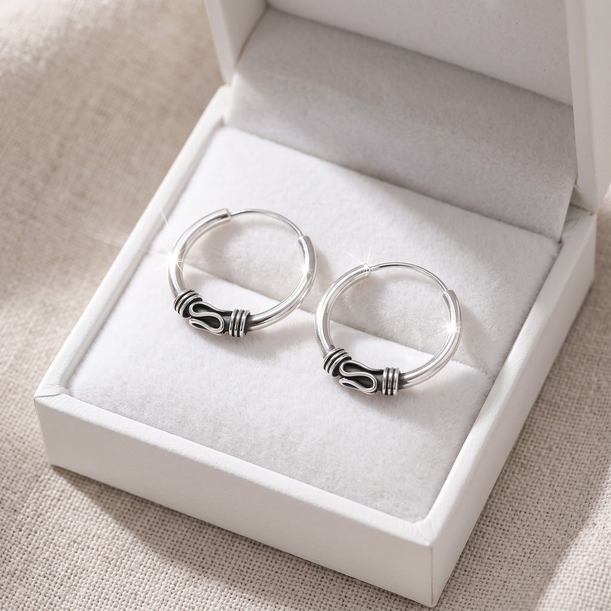Sterling Silver Ladies Dainty Bali Hoop Earrings in a white gift box, ready to give