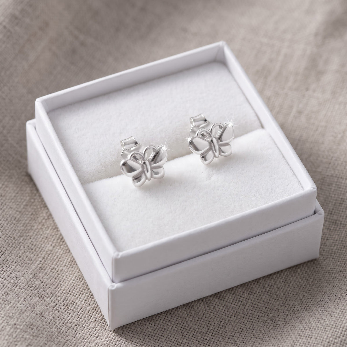 Sterling Silver Girls Small Butterfly Stud Earrings, 8mm in a white gift box, ready to give