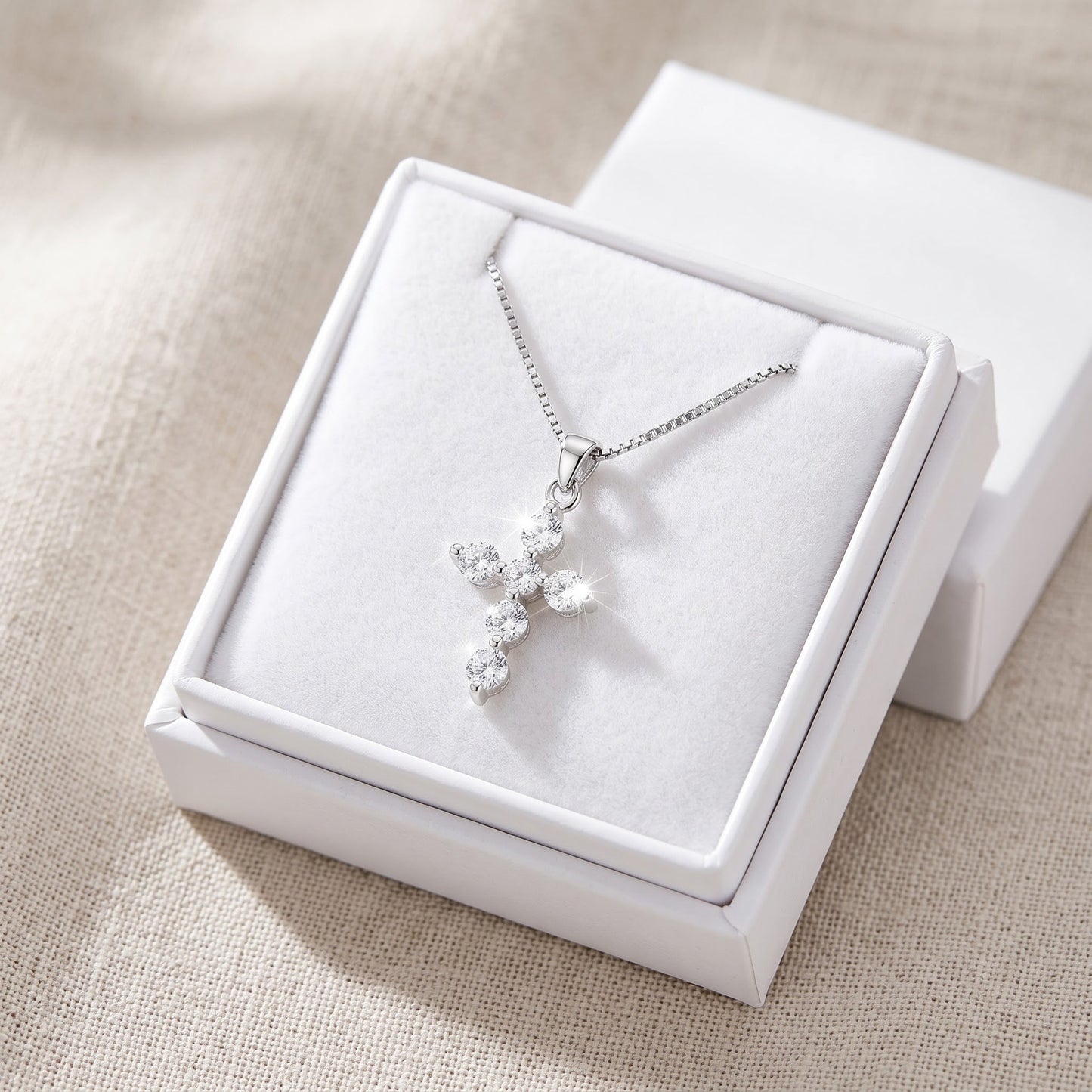 Sterling Silver Small CZ Cross Necklace in a white gift box, ready to give