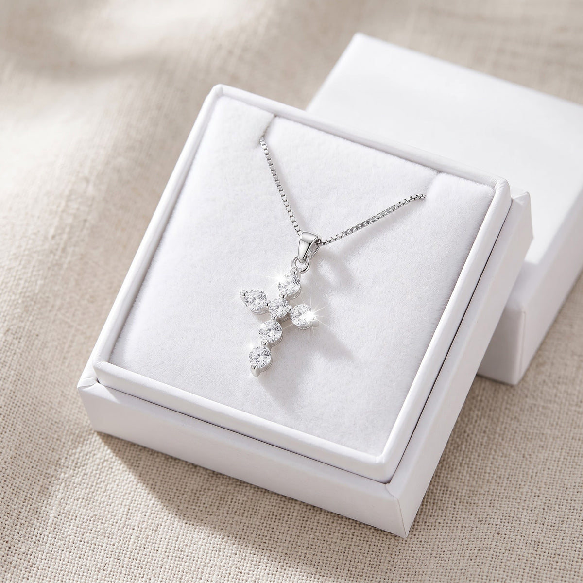 Sterling Silver Small CZ Cross Necklace in a white gift box, ready to give