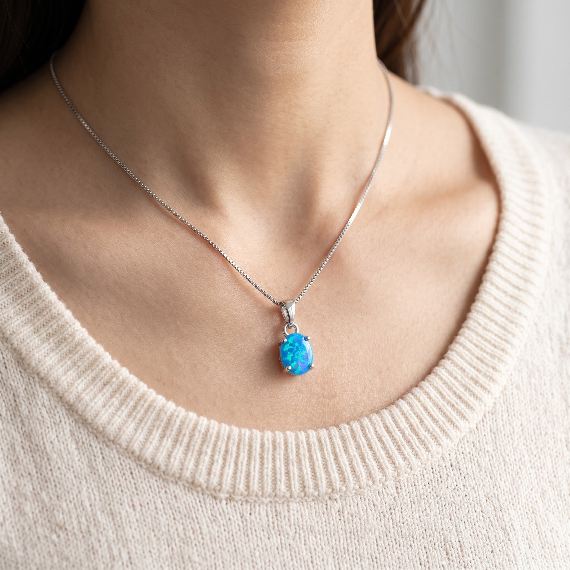 Sterling Silver Small Oval Created Blue Opal Necklace 18" worn, lifestyle photo