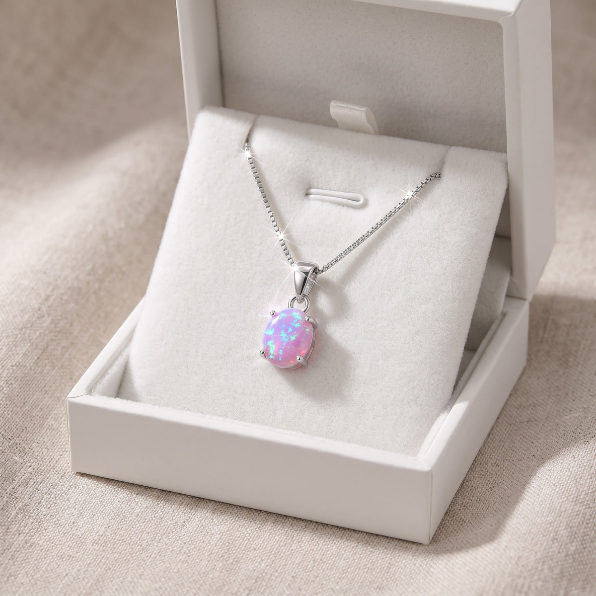 Sterling Silver Small Oval Created Pink Opal Necklace 18" in a white gift box, ready to give
