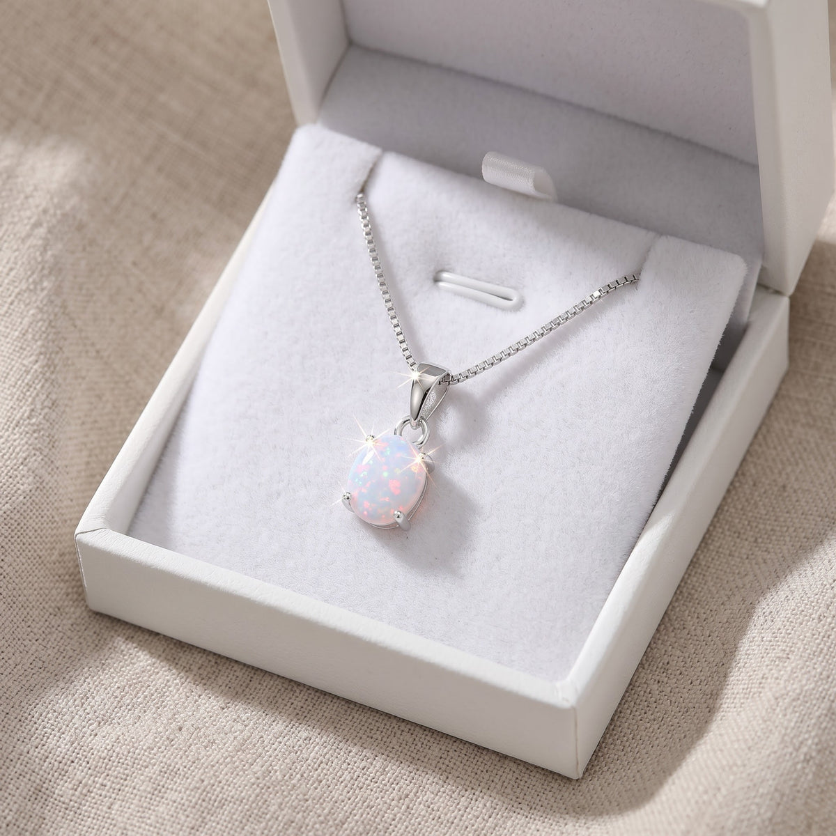 Sterling Silver Small Oval Created White Opal Necklace 18" in a white gift box, ready to give